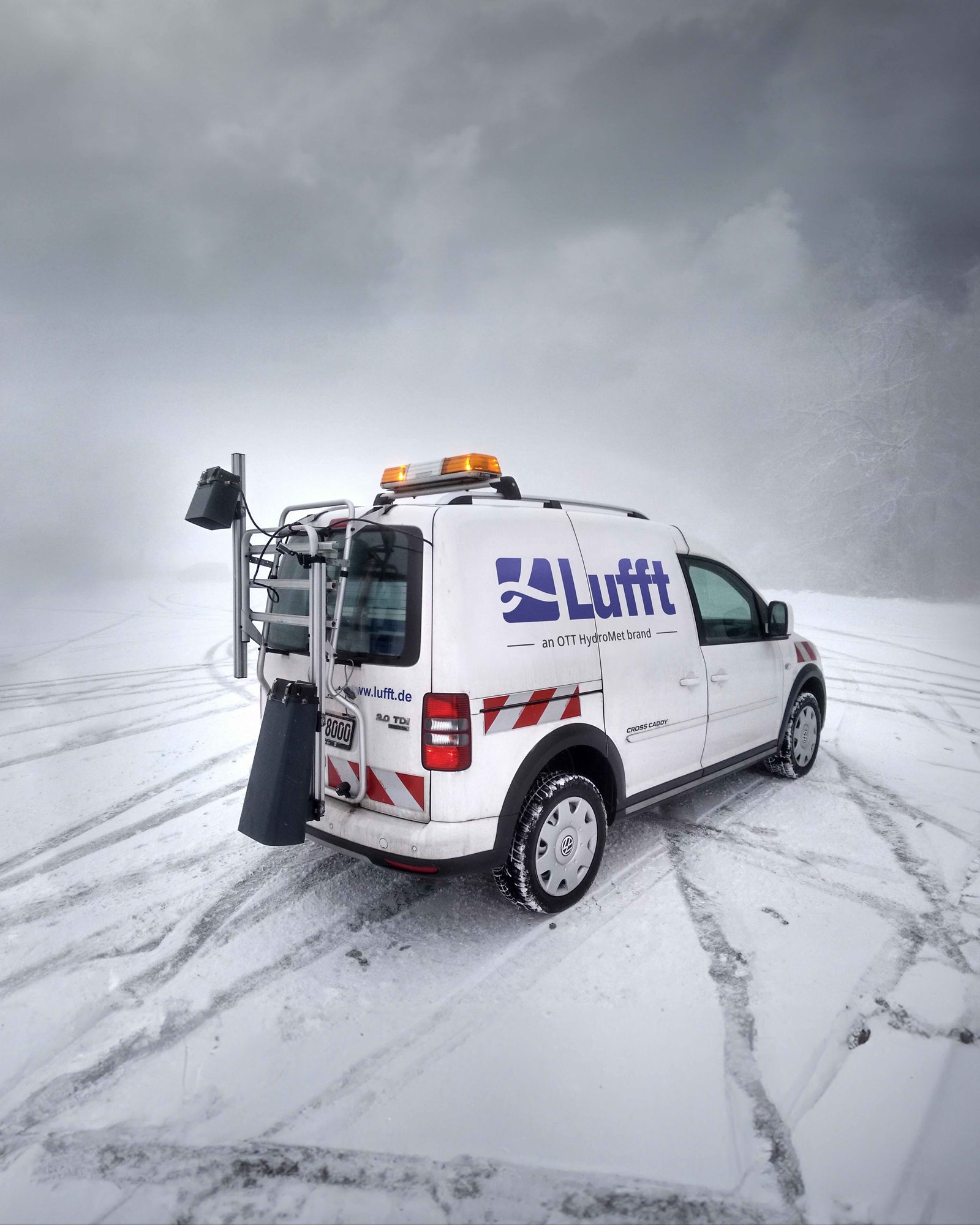 Mobile Advanced Road Weather Information System mounted on a car on an icy road